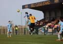 Henry Jones wins a header for WGC against Stotfold's Conor Clarke. Picture: LINDA BABAIE