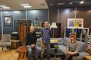The new shop interior with Emmaus Hertfordshire staff members Graham, Christian and Emily.
