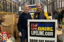Panshanger FC's Peter Monk at the drop-off point with Craig from charity Ukraine Lifeline.