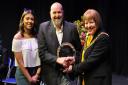 Lily Peterkin and Peter Heppelthwaite of Limitless Academy receiving a trophy from the then-mayor Councillor Barbara Fitzsimon at the Welwyn Drama Festival in 2019.