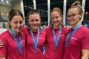 Hatfield Swimming Club members show off their medals from the East Region Championships.