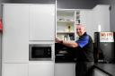 Matt Green unveils Everett Rovers' new kitchen.