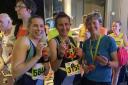 Zoe Stephens, Juliet Vine and Martha Hall of Garden City Runners with the county medals. Picture: GCR