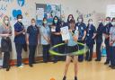 Nurse Carina Cruz hula hooped non-stop for four hours to raise funds for research at the East and North Hertfordshire NHS Trust