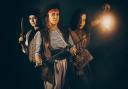 Jim Hawkins, played by Noah Breeze; Long John Silver, played by Hope Powell Eddy; and Ben Gunn, played by Alice Croot.