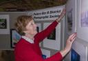 Helen Frost, vice president of Potters Bar and District Photographic Society adding a picture to the exhibition that is on at The Galleria in Hatfield until April 14.