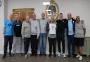 Colin proudly shows off his world record with members of Hatfield's Walking Football Group.