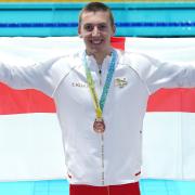 Team England's Luke Turley, aged 22, after securing bronze in the Birmingham 2022 men's 1500m freestyle