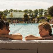 Harry Styles and Emma Corrin star in My Policeman. Here they are pictured in Hitchin\'s outdoor pool.