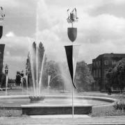 The Coronation Fountain in Parkway 1953 - with temporary banners as part of the Coronation celebrations in Welwyn Garden City. Image donated to the Welwyn Garden City Heritage Trust archive by Marian T.