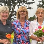 Ladies club captain Rosie Williams presents Audrey Mayes (right) and Debbie Birtwistle (left) with their prizes for the Clouston Vases.