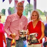 Ashleigh and Mike Davis receive their Mixed Jubilee Bowls trophies from club captain Lesley Hewitt (left) and ladies' captain Rosie Williams.