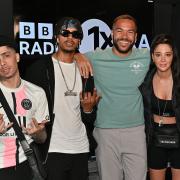 Dappy (left), real name Costadinos Contostavlos, Fazer, real name Richard Rawson, and Tulisa Contostavlos from N-Dubz appearing on the BBC Radio 1Xtra programme hosted by Reece Parkinson (second right).