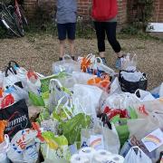 Emily and Bertie and the supplies they collected from their neighbours. Picture: Supplied