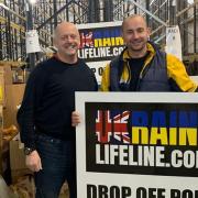 Panshanger FC's Peter Monk at the drop-off point with Craig from charity Ukraine Lifeline.