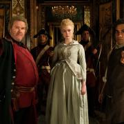 Douglas Hodge as Velementov, Elle Fanning as Catherine and Sacha Dhawan as Orlo in the first episode of season two of The Great.