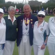 Potters Bar’s winning senior fours team of Diane Berry, Pam Rodgers, Anita Bowman and Diane Jewell with county president Terry Barker.