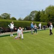 Members of Potters Bar Bowls Club’s coaching team instruct new bowlers at the club's invitation morning.