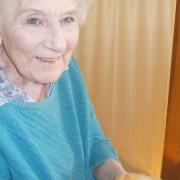 Jean Taylor, 87, holds a chick