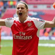 Kelly Smith celebrates with Arsenal fans