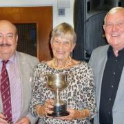 County councillor Ken Crofton (left) and club president Fred Goodege with novice singles winner Brenda Barber.