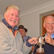 Brookmans Park Golf Club captain Brian Hall (right) presents club president Martin Connelly with the captain v president trophy.