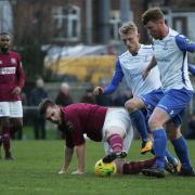 Dernell Wynter (left) looks on as his now manager Marc Weatherstone (right) makes a tackle on former WGC man Josh Hutchinson. Picture: KARYN HADDON