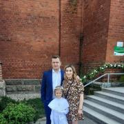 Zuzanna with her parents, Marlena and Mariusz from her first Holy Communion Mass