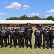 Chief Constable Charlie Hall, centre, with the 14 new trainee detectives at the July 7 graduation ceremony held at Herts police headquarters in Welwyn Garden City.