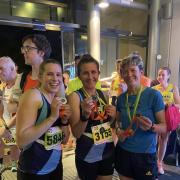 Zoe Stephens, Juliet Vine and Martha Hall of Garden City Runners with the county medals. Picture: GCR