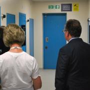 A volunteer inspecting a police custody suite with Police and Crime Commissioner of Hertfordshire David Lloyd.