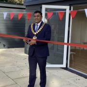 Mayor Pankit Shah cuts the ribbon to open the new buildings.