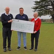 Brookmans Park present a cheque to Alex Bassan (middle) of The Change Foundation. Picture: MARGARET HALL