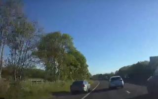 A car driving on the hard shoulder on the A1(M).